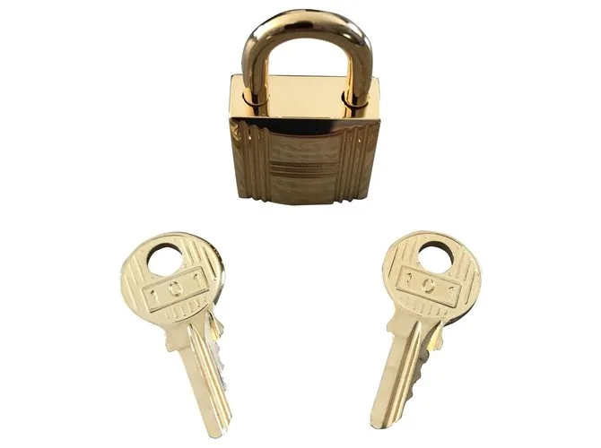 Candado de acero dorado Hermès para Kelly y Birkin Gold hardware 