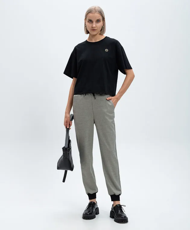 TWINSET BLACK TSHIRT WITH A METALLIC OVAL T LOGO WITH CRYSTALS